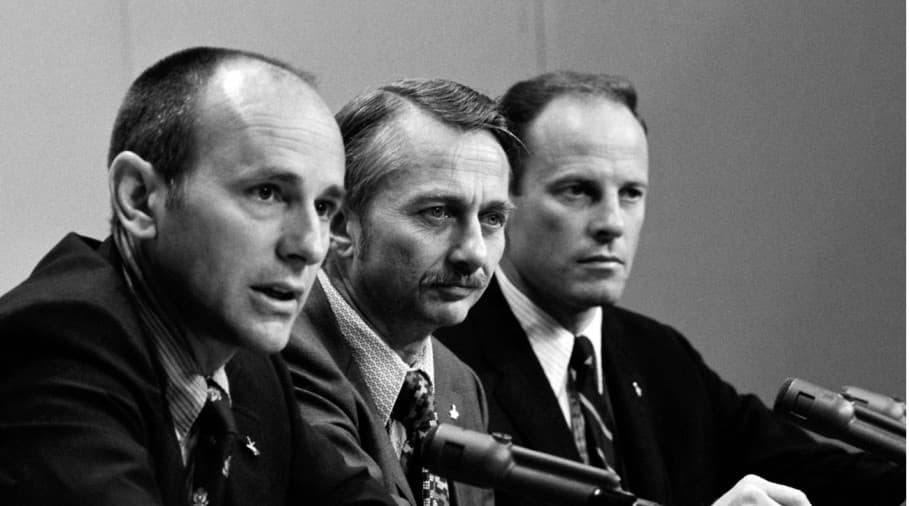The three Skylab 3 astronauts aboard their recovery ship